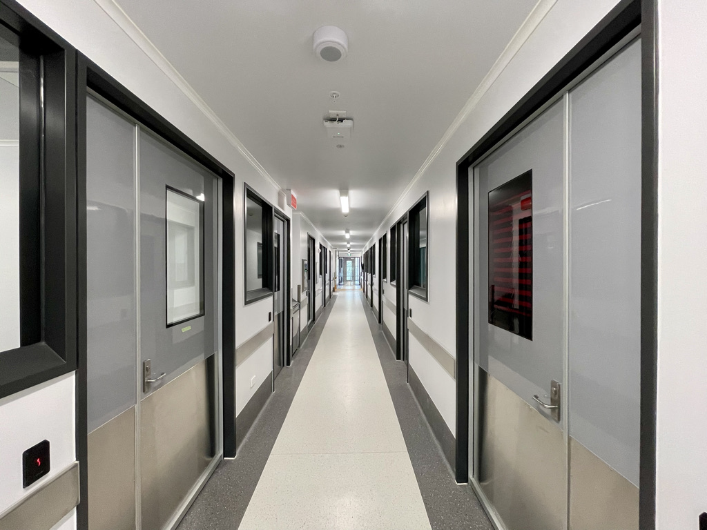 Hallway in a medical or industrial building with electronic security K2 doors